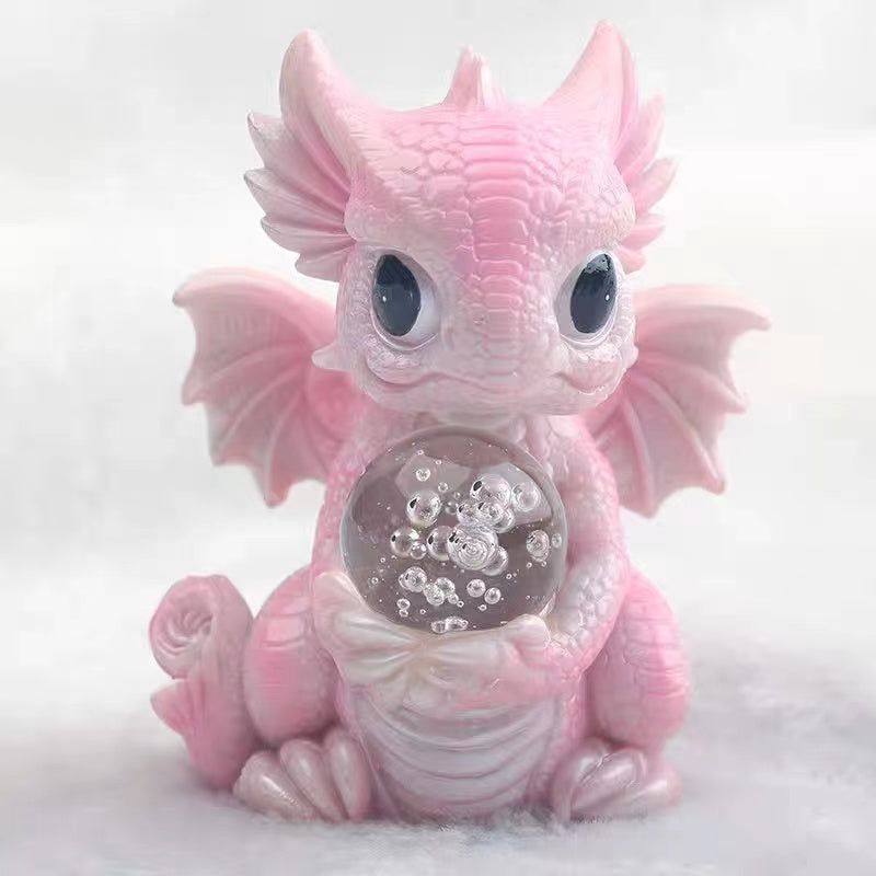 Baby dragon with crystal ball