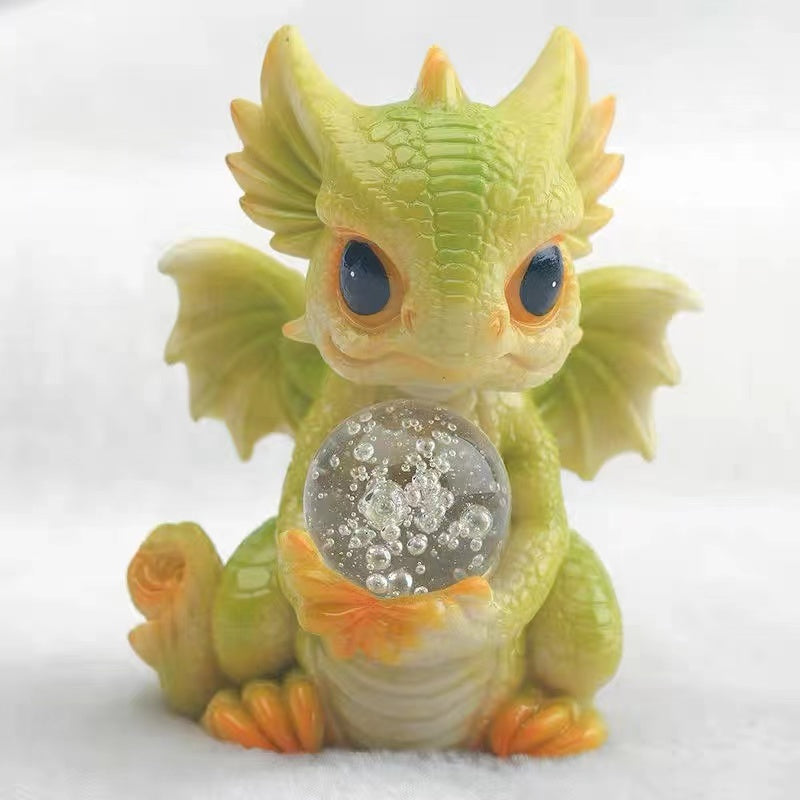 Baby dragon with crystal ball