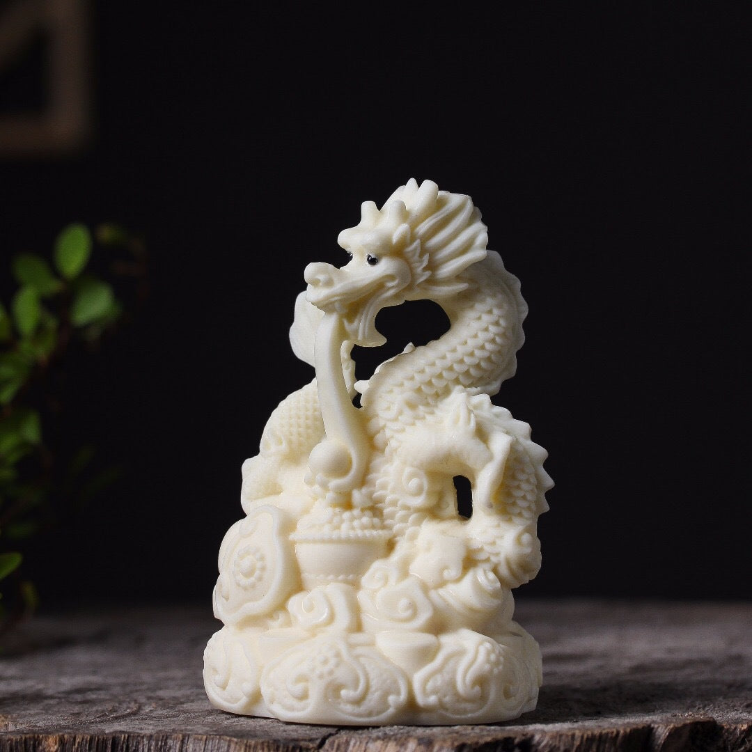 Ivory fruit hand-carved auspicious dragon spitting bead ornament