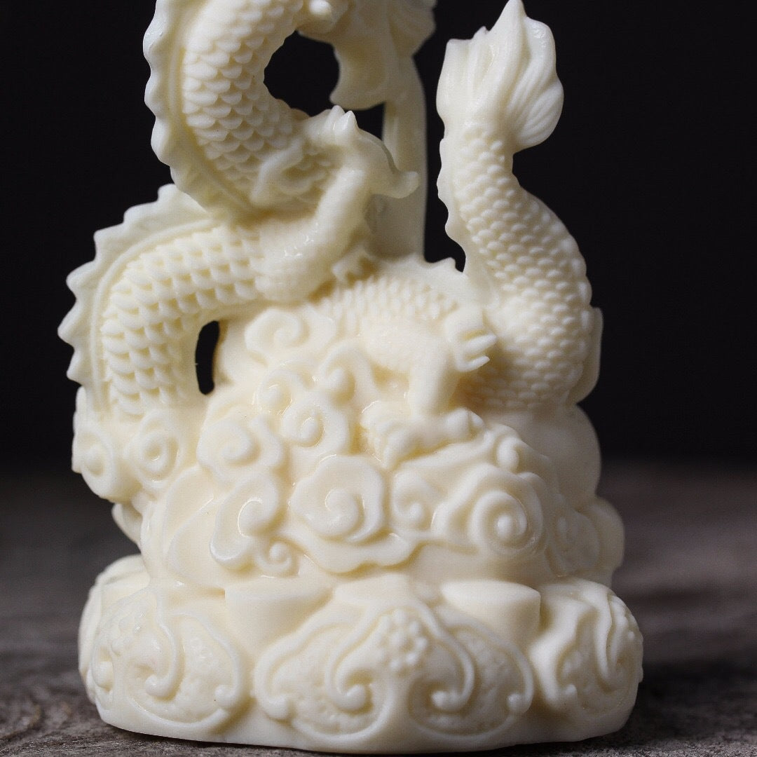 Ivory fruit hand-carved auspicious dragon spitting bead ornament