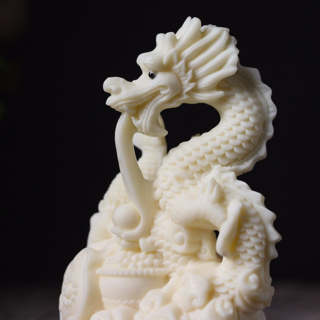 Ivory fruit hand-carved auspicious dragon spitting bead ornament